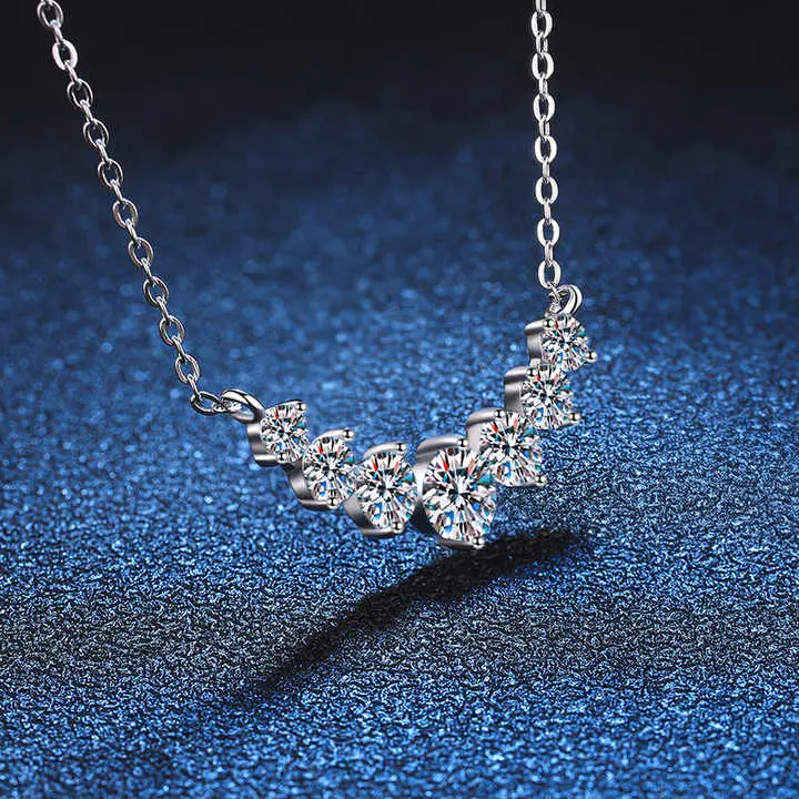 How does moissanite compare to diamond pendants?